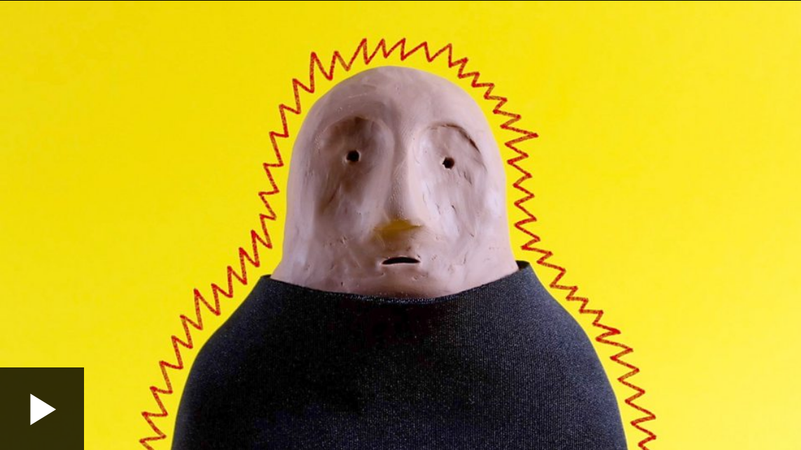 A clay figure in a black t-shirt on a yellow background, surrounded by a spiky red line