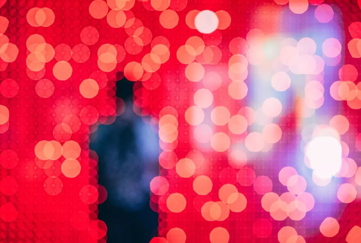 Silhouette of a person over a red background